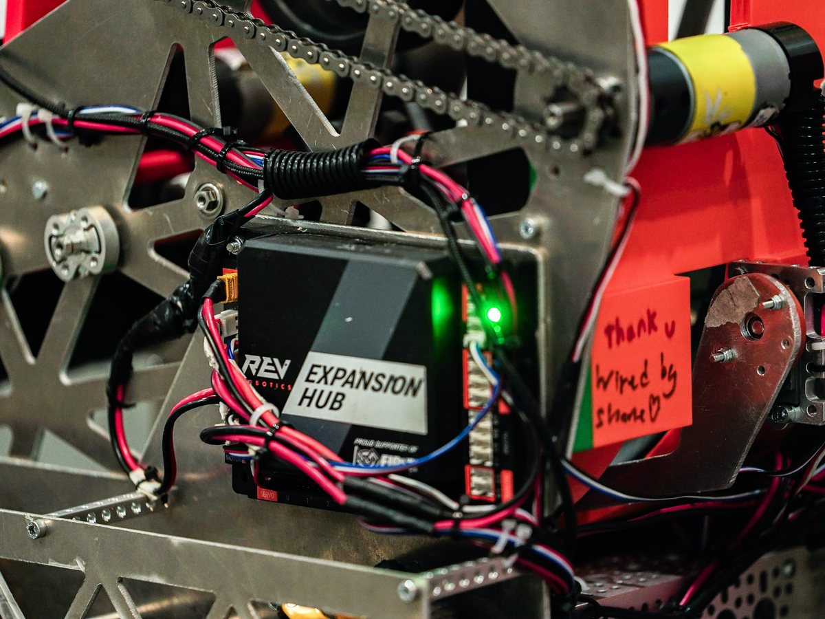 A REV Expansion Hub wired into a machined aluminum frame on Mech-a-Mind's robot